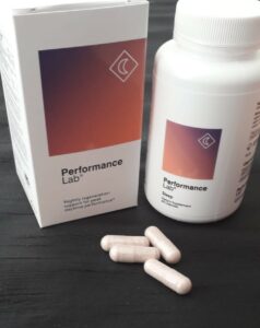 A bottle of Performance Lab Sleep with pills on the table