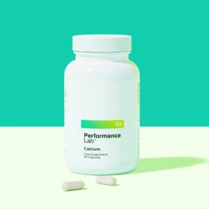 A bottle of Performance Lab Calcium and two tablets