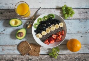 A bowl of breakfast cereal and fruit