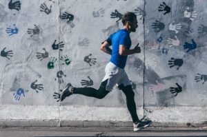 Man running against a wall