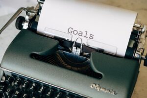 A typewriter spells out the word Goals